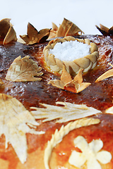 Image showing round loaf with floral patern and salt