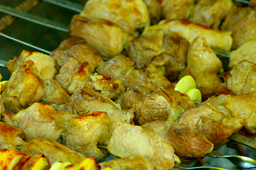 Image showing appetizing pieces of fried meat on the fire