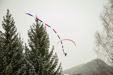 Image showing Paraglider is flying in the sky