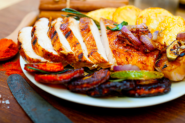 Image showing roasted grilled BBQ chicken breast with herbs and spices