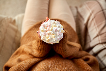 Image showing woman holding mug of marshmallow and whipped cream