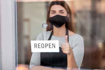 Image showing woman in mask with reopen banner showing thumbs up