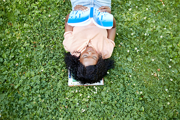 Image showing african student girl reading math textbook