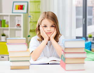 Image showing bored student girl reading book at home