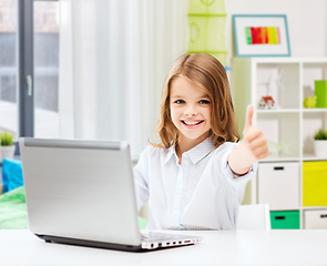 Image showing smiling student girl with laptop showing thumbs up