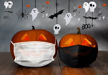 Image showing carved pumpkins or jack-o-lanterns in masks
