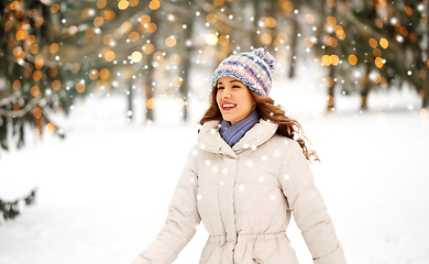 Image showing happy smiling woman outdoors in winter forest