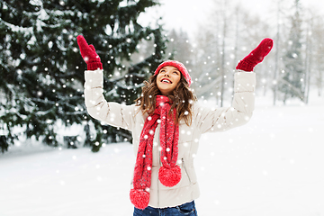 Image showing happy young woman in winter park over snow