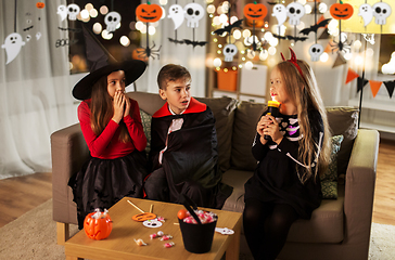 Image showing kids in halloween costumes playing at home