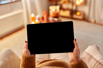 Image showing woman with tablet pc at home on halloween