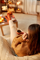 Image showing woman calling on smartphone at home on halloween