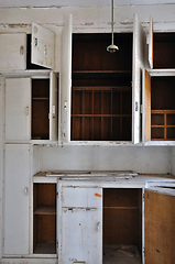 Image showing empty cupboards in abandoned kitchen