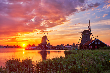 Image showing Windmills at Zaanse Schans in Holland on sunset. Zaandam, Nether