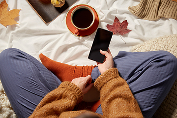 Image showing woman with smartphone at home in autumn