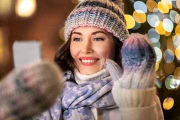 Image showing woman with phone having video call on christmas