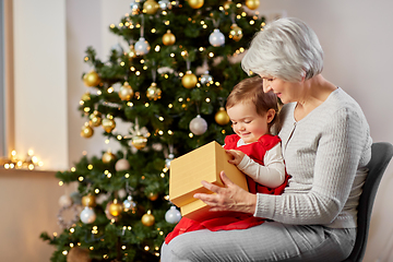 Image showing grandmother and baby girl with christmas gift