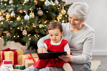 Image showing grandmother and baby girl with christmas gifts