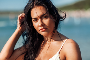 Image showing young woman in bikini swimsuit on beach