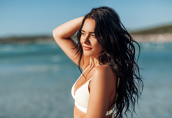 Image showing beautiful young woman in bikini swimsuit on beach