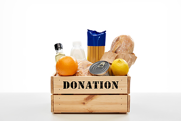 Image showing food donation in wooden box on table