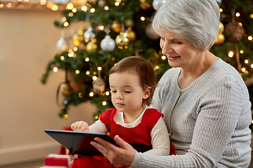 Image showing grandmother and baby girl with christmas gifts