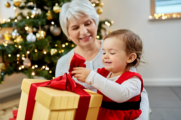 Image showing grandmother and baby girl with christmas gift