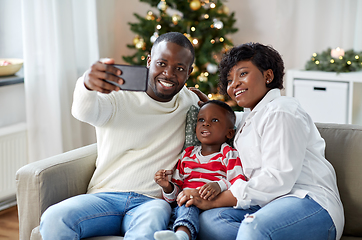 Image showing african family taking selfie on christmas at home