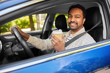 Image showing happy indian man or driver with coffee driving car