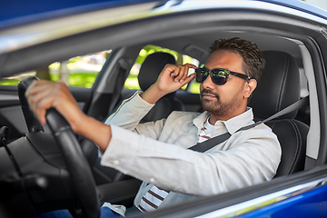 Image showing indian man or driver in sunglasses driving car