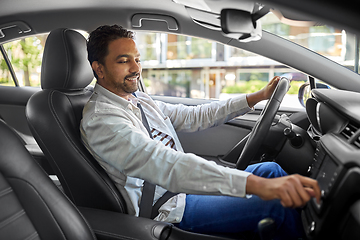 Image showing smiling indian man or driver driving car