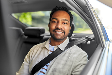 Image showing smiling indian male passenger in taxi car