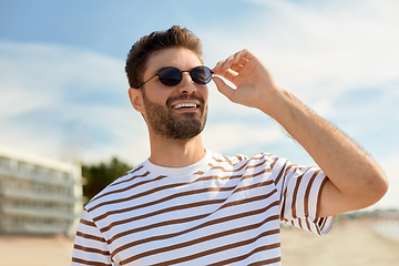 Image showing young man in sunglasses on summer beach