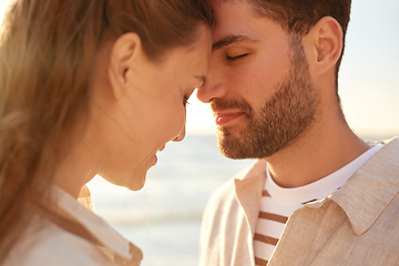 Image showing happy couple with closed eyes on summer beach