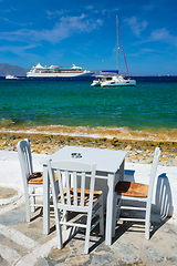 Image showing Catamaran yacht and cruise liner is Aegean sea. Chora, Mykonos island, Greece