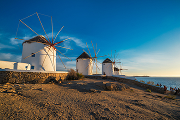 Image showing Traditional greek windmills on Mykonos island at sunrise, Cyclades, Greece