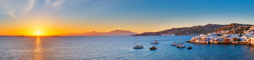 Image showing Sunset in Mykonos, Greece, with cruise ship and yachts in the harbor