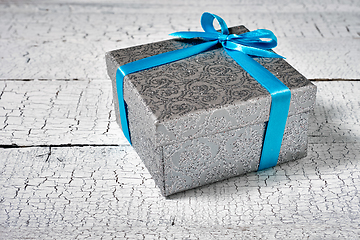 Image showing Gift box with blue ribbon