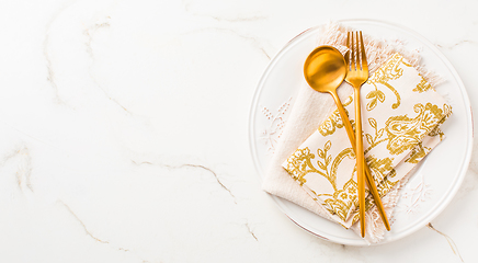 Image showing Festive place setting for Christmas or New Year in golden tone