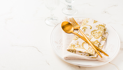 Image showing Festive place setting for Christmas or New Year in golden tone