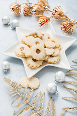 Image showing Homemade Christmas cookies and ornaments on kitchen table