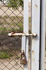 Image showing metal gates and a fence