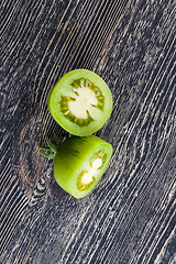 Image showing cut one green tomato