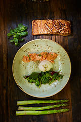 Image showing Slow Cooked Salmon fillet steak with salad on plate, Sous-Vide Cooking Salmon Fish