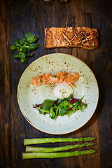 Image showing Slow Cooked Salmon fillet steak with salad on plate, Sous-Vide Cooking Salmon Fish