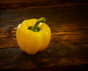 Image showing Fresh yellow sweet peper onwooden background.
