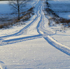 Image showing Track on a snow-covered road