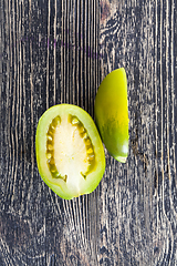 Image showing cut one green tomato