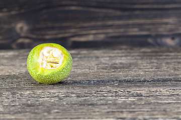 Image showing cut green walnut