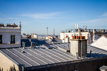 Image showing The traditional roofs of paris and the eiffel tower