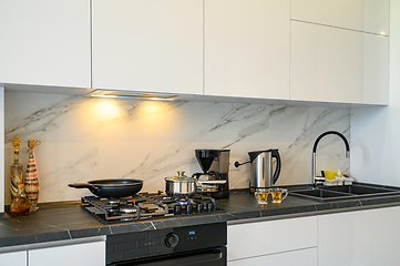 Image showing Closeup to modern kitchen cupboard